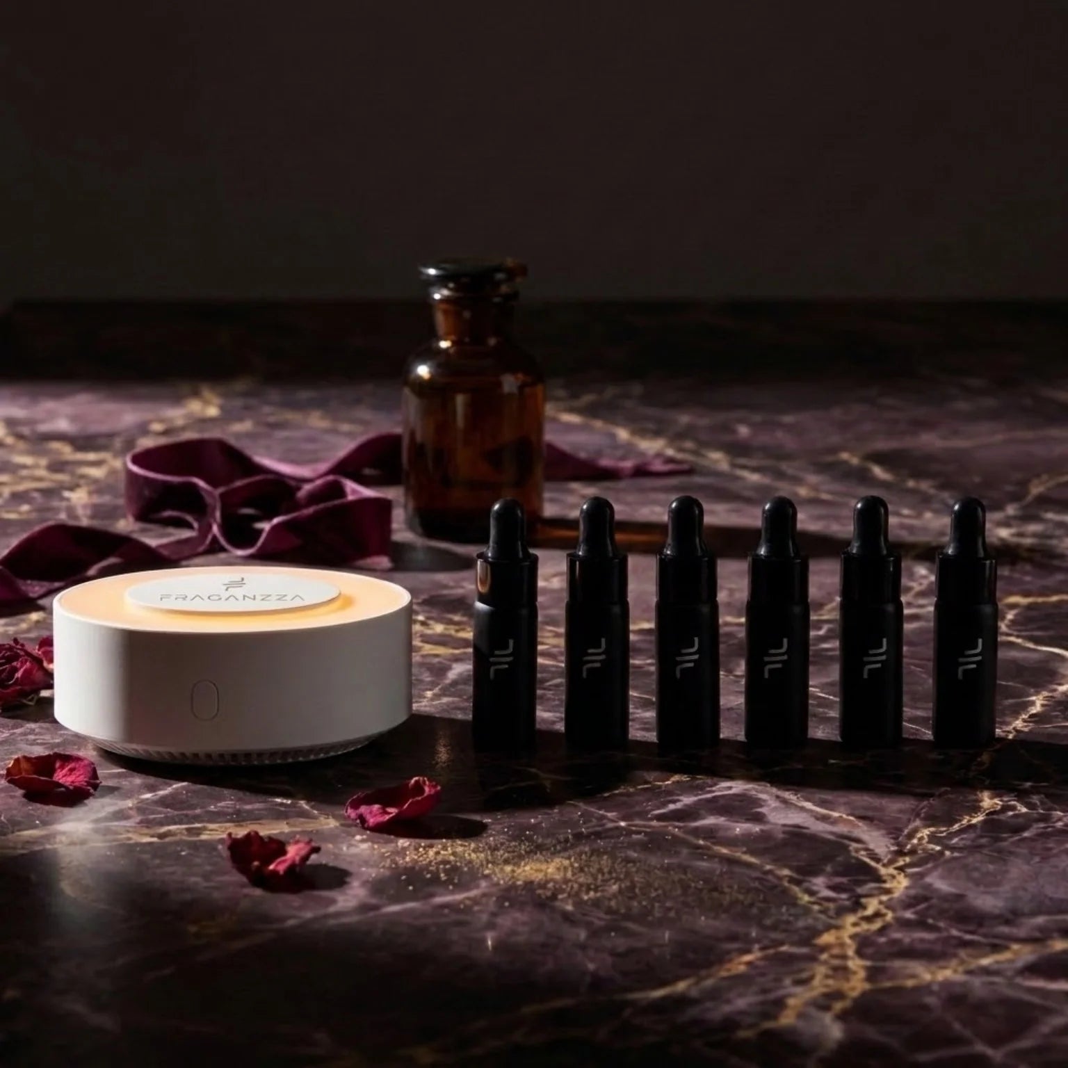 Fraganzza Aroma Inspired by Perfumes fragrance samples on luxurious dark marble with rose petals