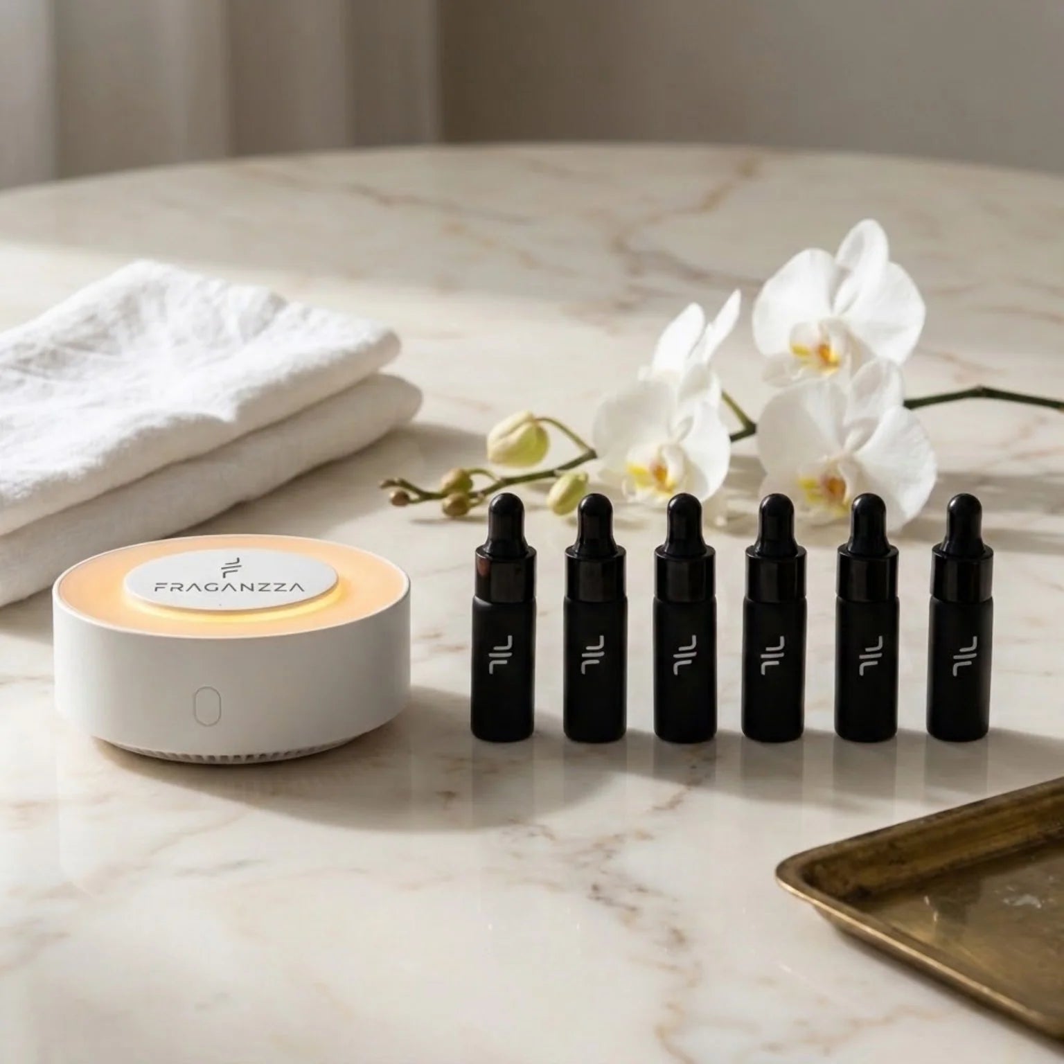 Fraganzza Aroma Inspired by Hotels fragrance sample collection with white orchids and diffuser